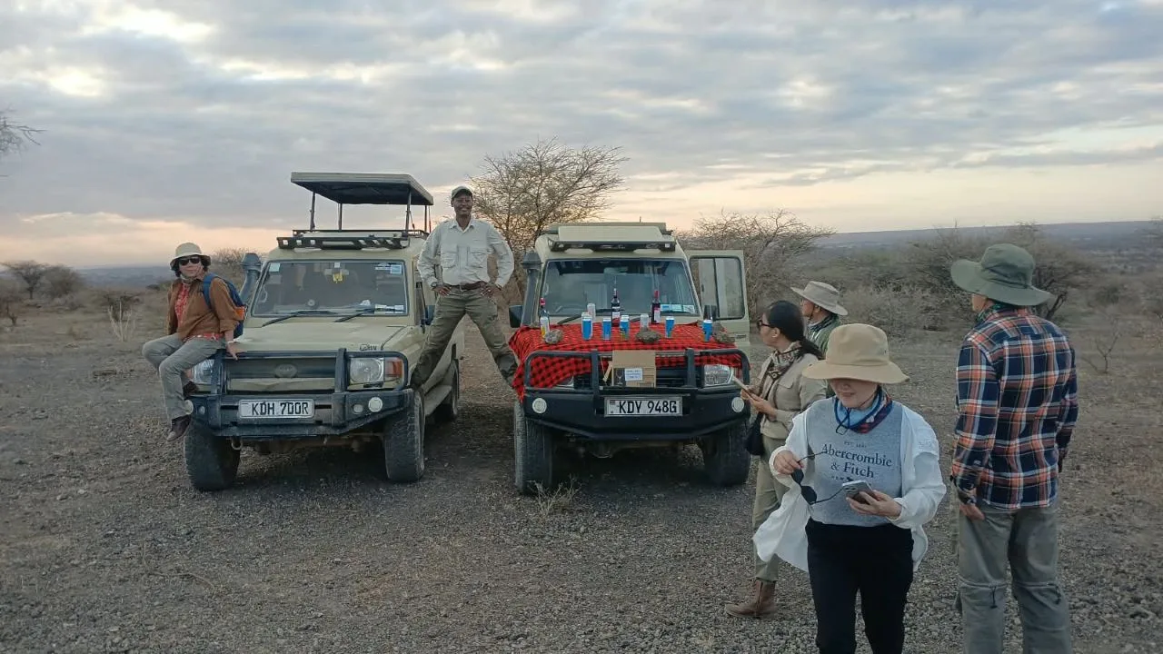 Kenya Tanzania Border Crossing on Honeymoon Safari Honeymoon couple crossing from Kenya to Tanzania during a private East Africa safari